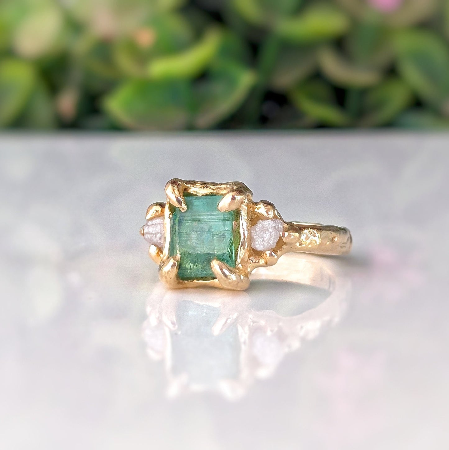 Raw mint green Emerald and diamond engagement ring in solid 14k gold, featuring nature-inspired rustic design.