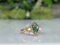 Kite-shaped Moss Agate and Herkimer diamond ring, handcrafted in gold, symbolizing love and friendship.