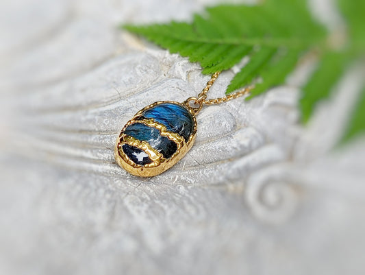 Kintsugi necklace featuring blue Labradorite, handcrafted with 18k Gold plating on a 21-inch gold filled chain.