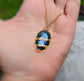 Oval blue Labradorite Kintsugi necklace on a gold chain, crafted with electroforming, plated in 18k gold.