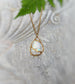 Kintsugi style necklace featuring large pear-shaped rainbow Moonstone set in 18k gold on a chain.