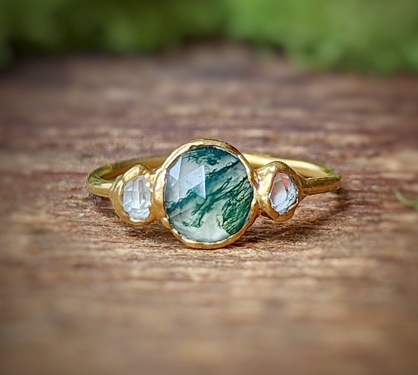 Moss Agate and Herkimer diamond engagement ring on a gold band, showcasing natural beauty and unique design.