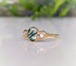 Moss Agate and Herkimer diamond engagement ring on a gold band, showcasing natural beauty and unique design.