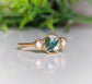 Handcrafted Moss Agate engagement ring featuring raw Herkimer diamonds set in an 18k gold band.