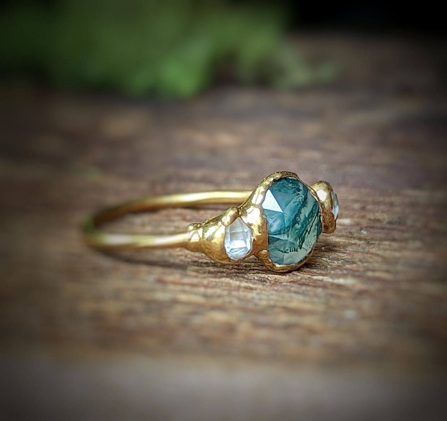 Moss Agate and Herkimer diamond ring on an 18k gold band, showcasing natural beauty and unique craftsmanship.