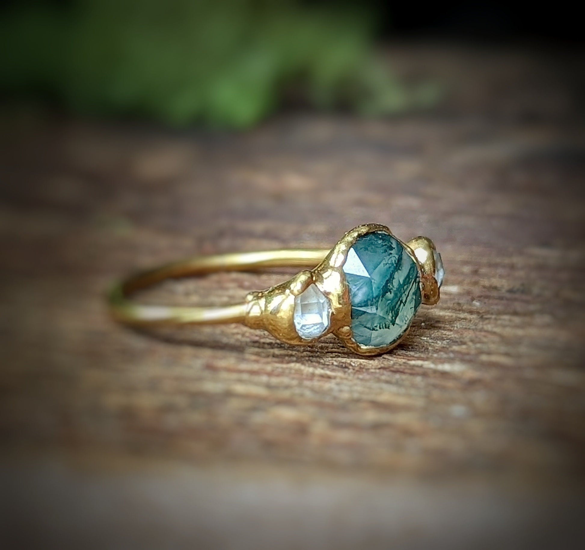 Moss Agate and Herkimer diamond ring on an 18k gold band, showcasing natural beauty and unique craftsmanship.