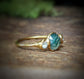 Moss Agate and Herkimer diamond ring on an 18k gold band, showcasing natural beauty and unique craftsmanship.