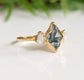 Moss Agate lozenge engagement ring with Herkimer diamonds on a 14k gold band, showcasing nature-inspired elegance.