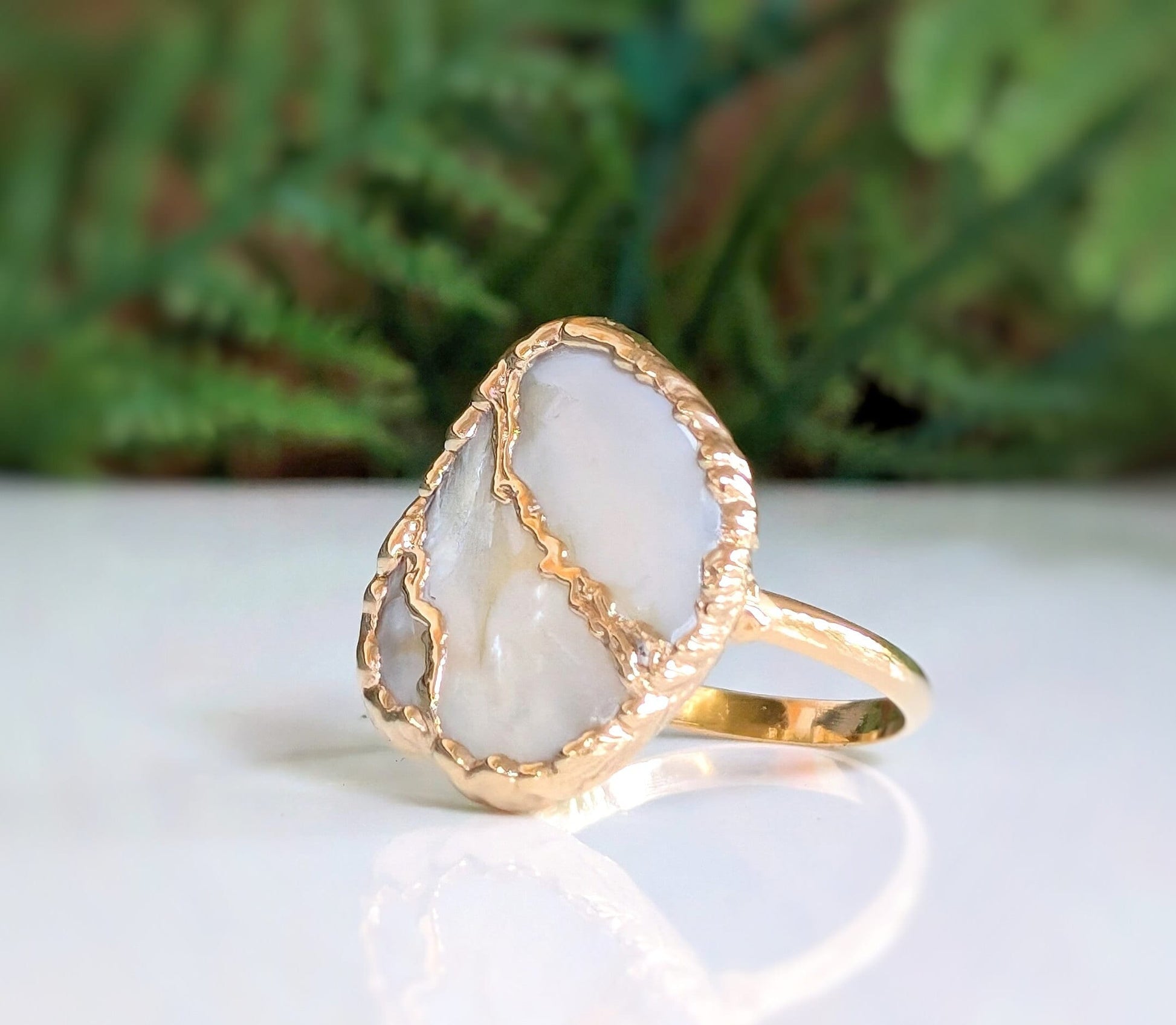 Handcrafted Mother of Pearl Kintsugi ring on a gold-filled band, perfect as a unique gift for any occasion.