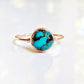 Natural Turquoise ring featuring a round 10mm stone on a delicate 14k gold filled band, showcasing unique color variations.
