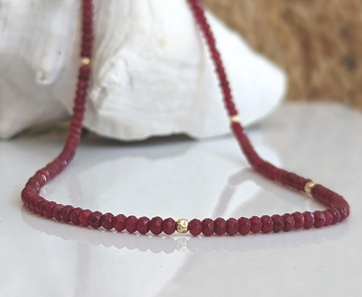 Handmade Ruby beaded necklace featuring deep pink hues and gold accents, perfect for bridal wear or thoughtful gifts.