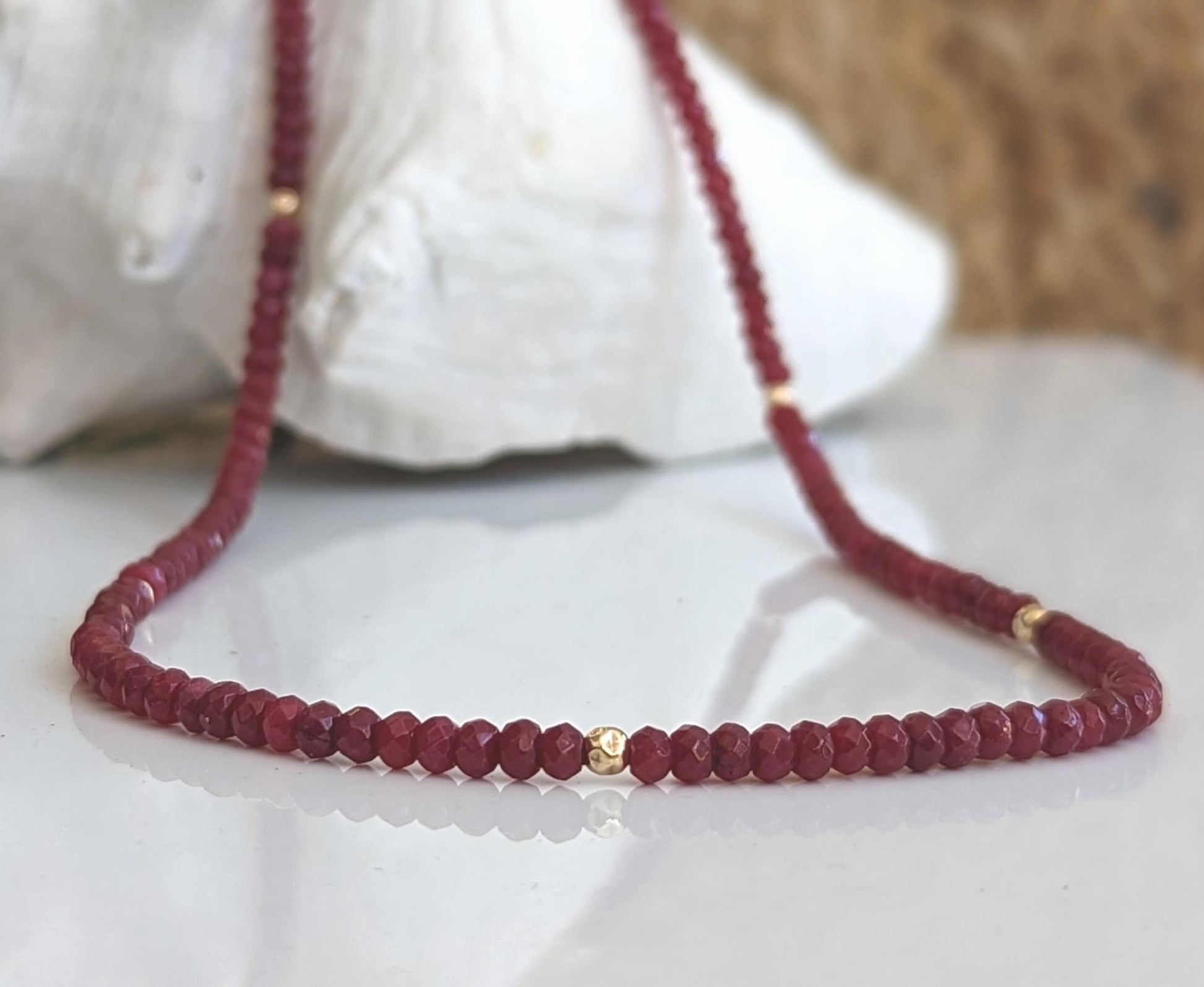 Handmade Ruby beaded necklace featuring deep pink hues and gold accents, perfect for bridal wear or thoughtful gifts.