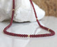 Handmade Ruby beaded necklace featuring deep pink hues and gold accents, perfect for bridal wear or thoughtful gifts.