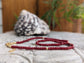 Handmade Ruby beaded necklace with gold accents, showcasing the rich dark pink hues of July's birthstone.