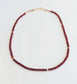 Handmade Ruby beaded necklace featuring deep pink Ruby beads and gold accents, perfect for any occasion.