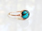 Natural turquoise ring featuring a 10mm round stone on a gold-filled band, uniquely handcrafted with vibrant colors.