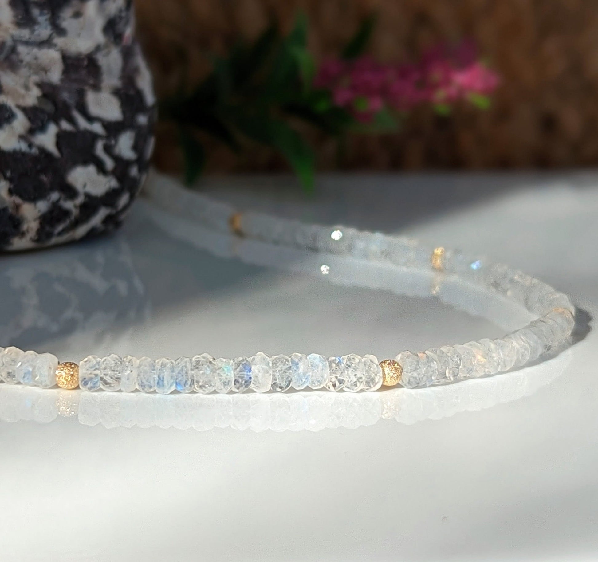 Rainbow Moonstone faceted beaded necklace showcasing natural beauty and healing properties.