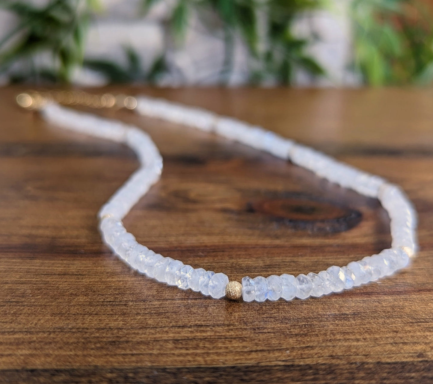 Rainbow Moonstone faceted beaded necklace highlighting ethereal beauty and natural healing properties.