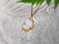Handcrafted Rainbow Moonstone Kintsugi necklace, 18k gold plated with a pear shape pendant on a 14k gold filled chain.
