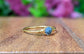 Raw blue diamond engagement ring set on solid 18k gold band, uniquely handcrafted for a special occasion.