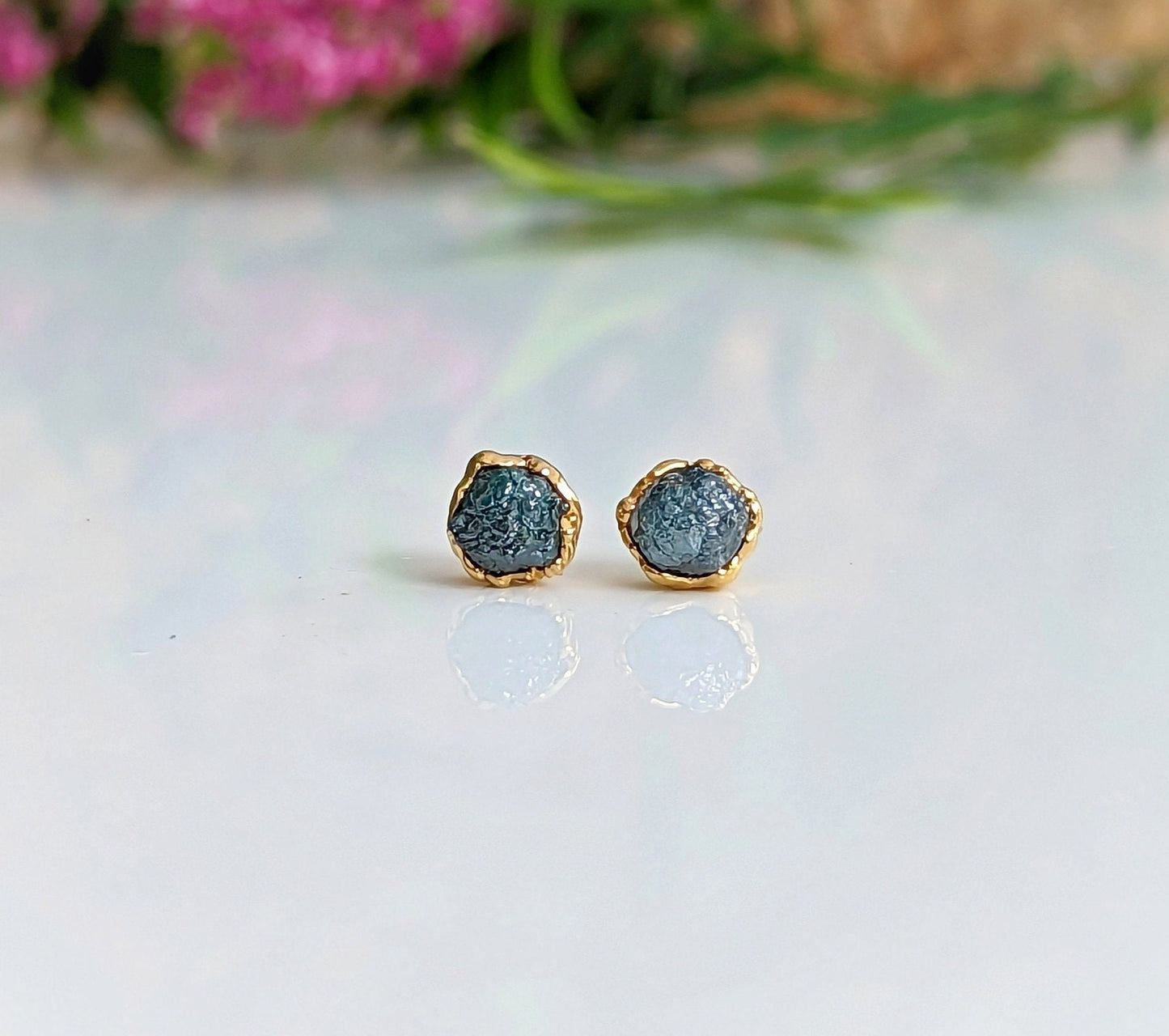 Raw blue diamond stud earrings set in gold, perfect for bridal wear or casual looks. Ethically sourced and handcrafted.