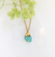 Handcrafted raw crystal necklace featuring a vibrant turquoise gemstone on a gold-filled chain.