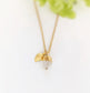 Handcrafted raw crystal necklace with gold chain and leaf charm, perfect for unique birthday gifts.