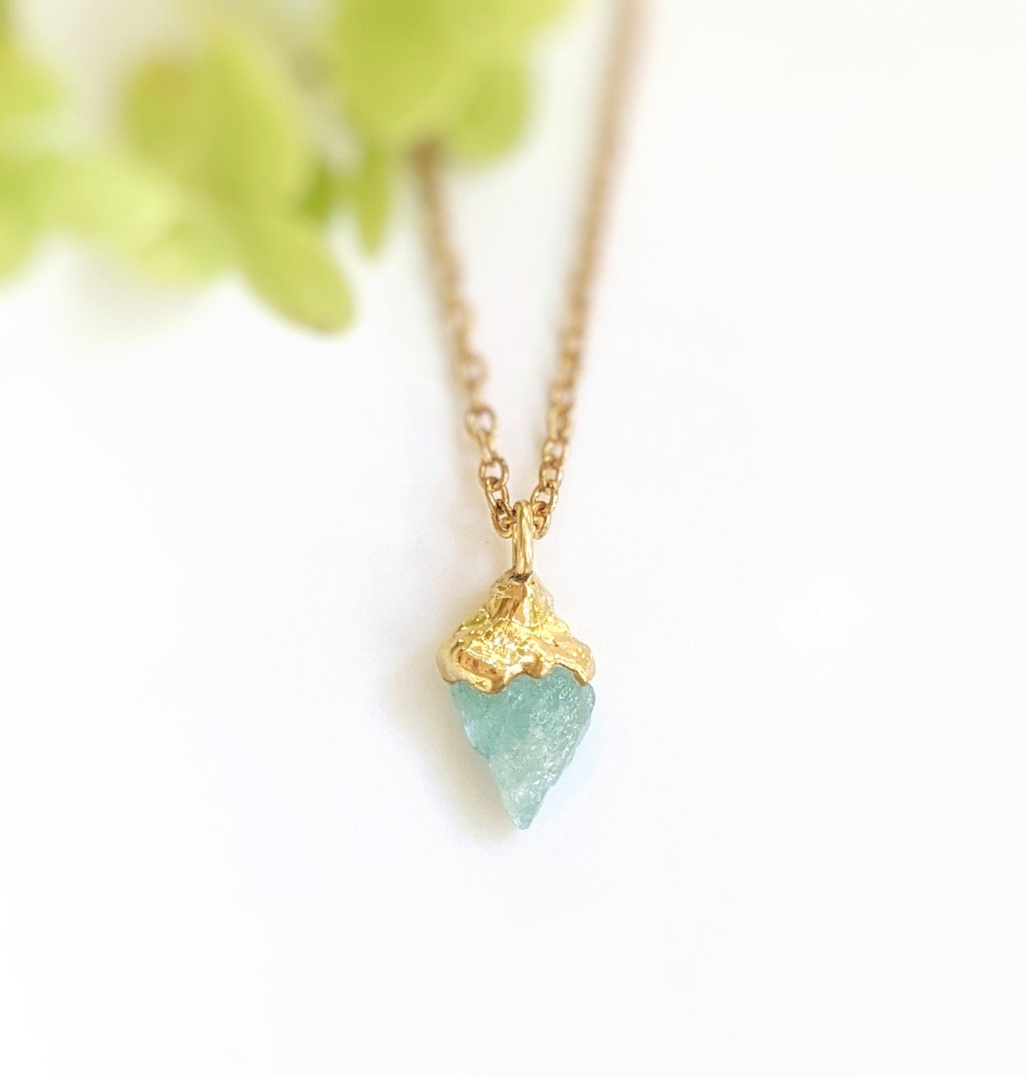 Handcrafted raw crystal necklace featuring a blue gemstone on a gold-filled chain, perfect for unique gifts.