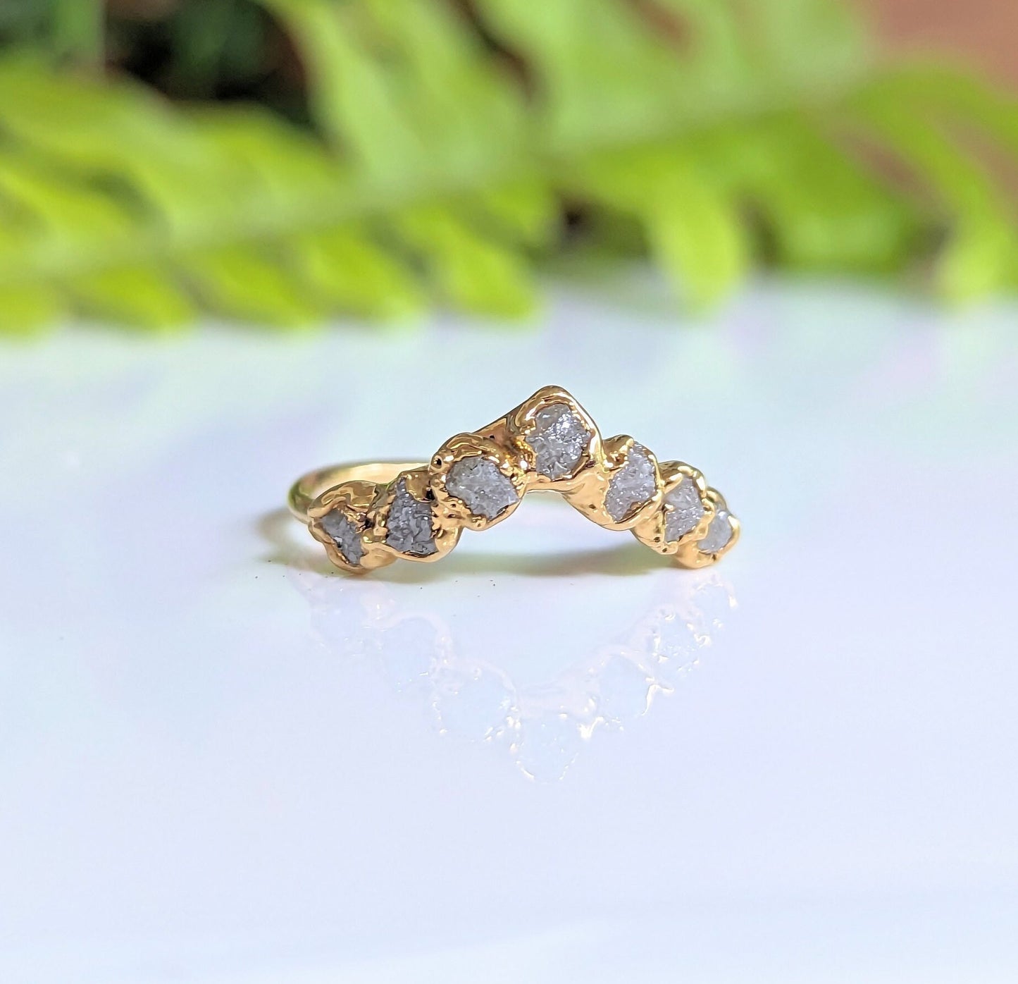 Raw diamond Chevron wedding band featuring 7 conflict-free diamonds on a sleek gold band.