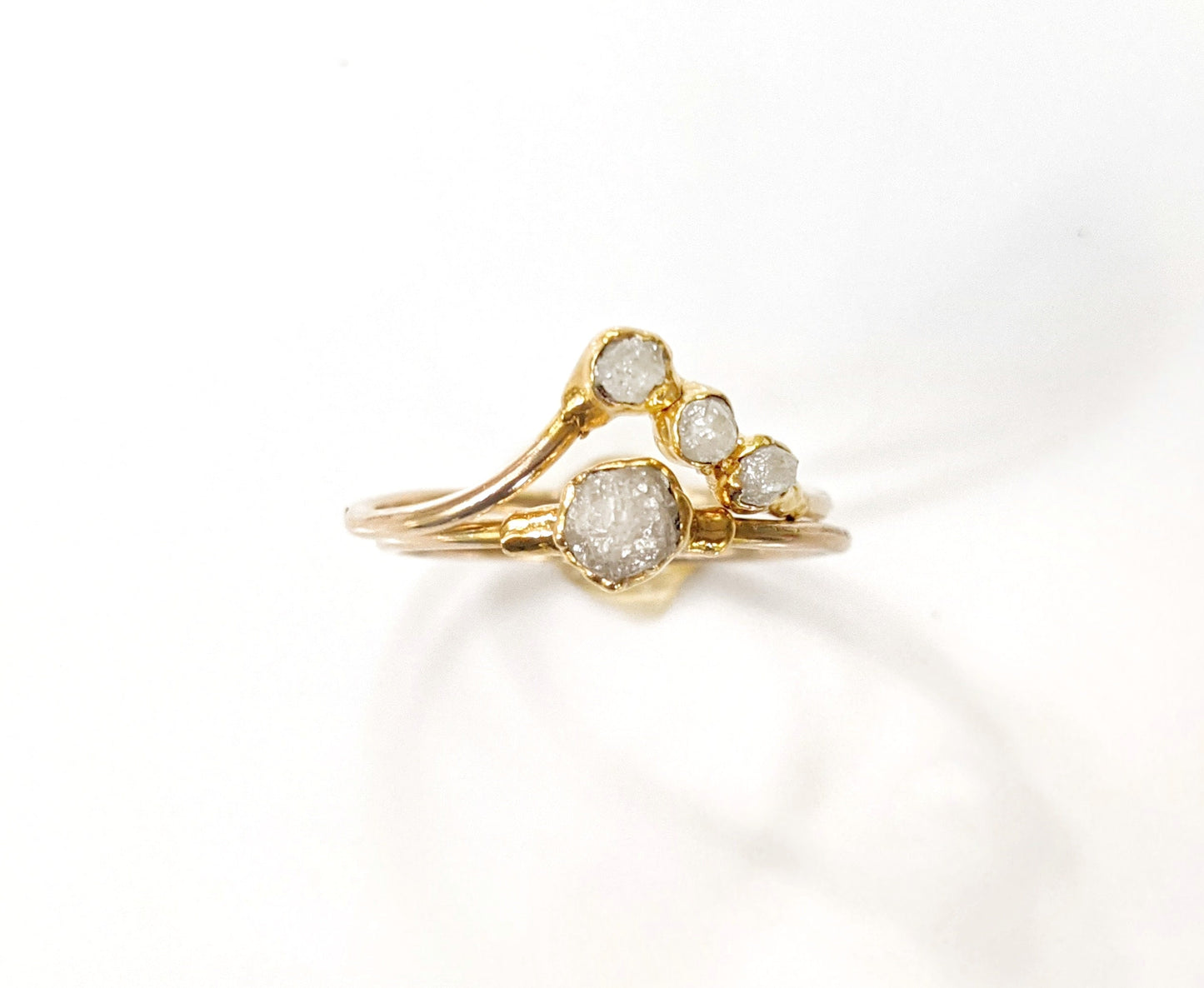 Handcrafted raw diamond chevron wedding ring set with ethically sourced uncut diamonds and 18k gold bands.