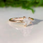 Raw diamond engagement ring in 14k gold setting, showcasing natural beauty and craftsmanship.