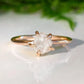 Raw diamond engagement ring with uncut diamond set in a rose gold band, symbolizing unique love and nature's beauty.
