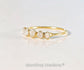 Handcrafted raw diamond Eternity ring in 18k gold setting, showcasing five uncut diamonds.