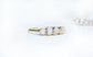 Raw diamond eternity ring in 14k gold with five conflict-free raw diamonds, symbolizing everlasting love.