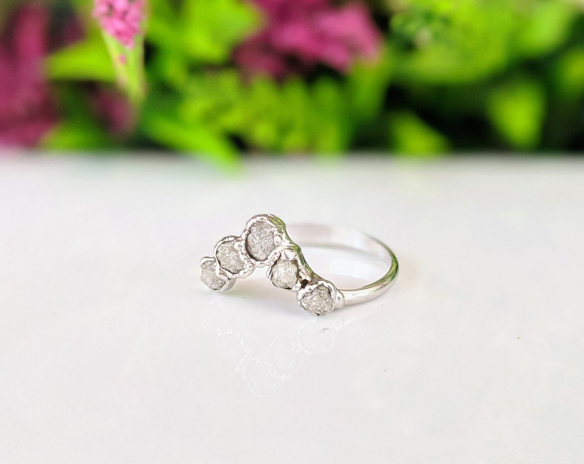 Raw diamond Gold Chevron ring showcasing five conflict-free diamonds on a sleek silver band.