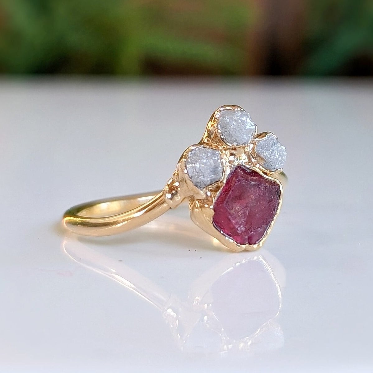 Raw diamond and pink spinel chevron engagement ring with unique handcrafted design.
