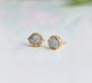 Handcrafted raw diamond stud earrings with gold edges, showcasing uncut natural beauty and timeless elegance.
