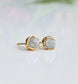 Handcrafted raw diamond stud earrings in gold setting, showcasing natural, uncut diamonds with a sparkling finish.