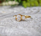 Raw diamond wedding ring set in solid 18k gold featuring three unique raw diamonds.