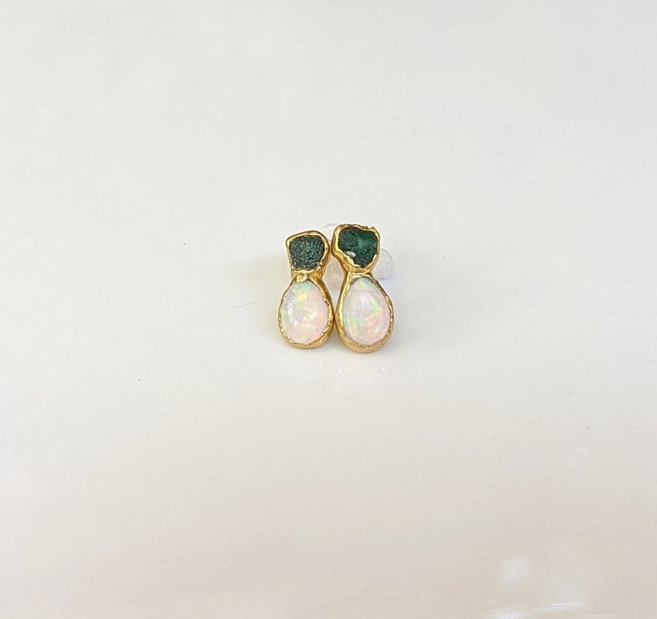 Dainty raw Emerald and Opal stud earrings with gold accents, perfect for bridal wear or unique gifts.
