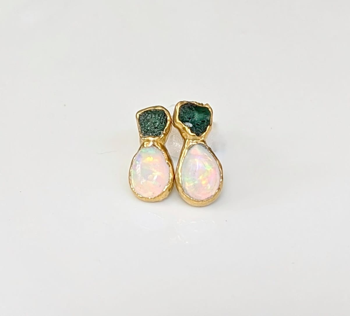 Dainty raw Emerald and Opal stud earrings with gold accents, perfect for bridal or everyday elegance.