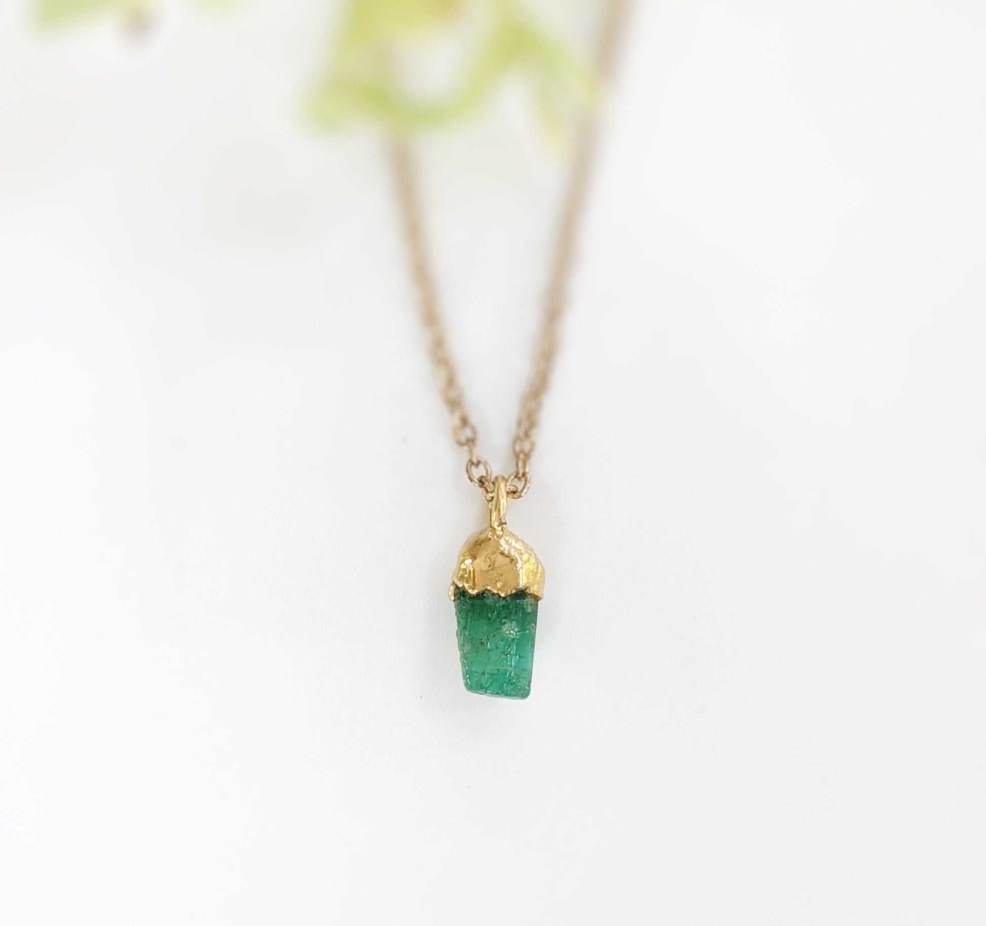 Handcrafted raw green crystal necklace on a gold chain, perfect gift for birthdays and special occasions.