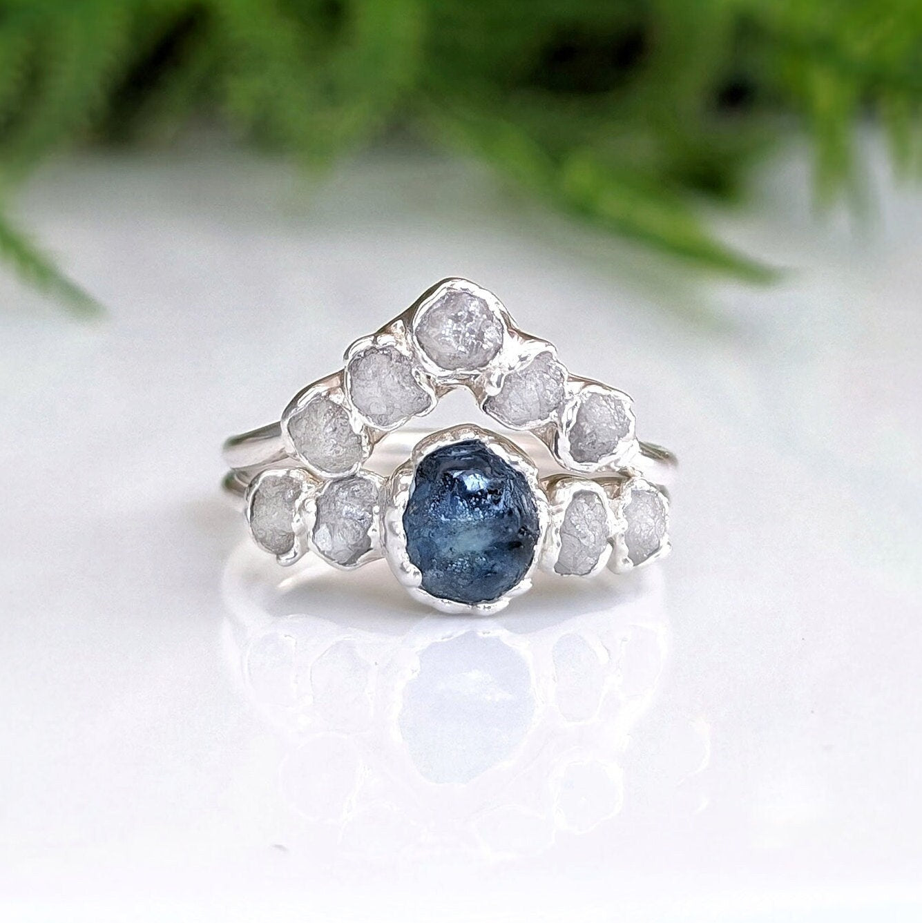 Raw Montana Sapphire and diamond bridal ring set in sterling silver, showcasing unique teal blue sapphire and conflict-free diamonds.