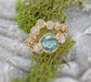 Raw Montana Sapphire and diamond ring set in solid 14k gold, uniquely handcrafted wedding jewelry.