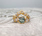 Handcrafted raw Montana Sapphire and diamond ring set on a solid 14k gold chevron band.