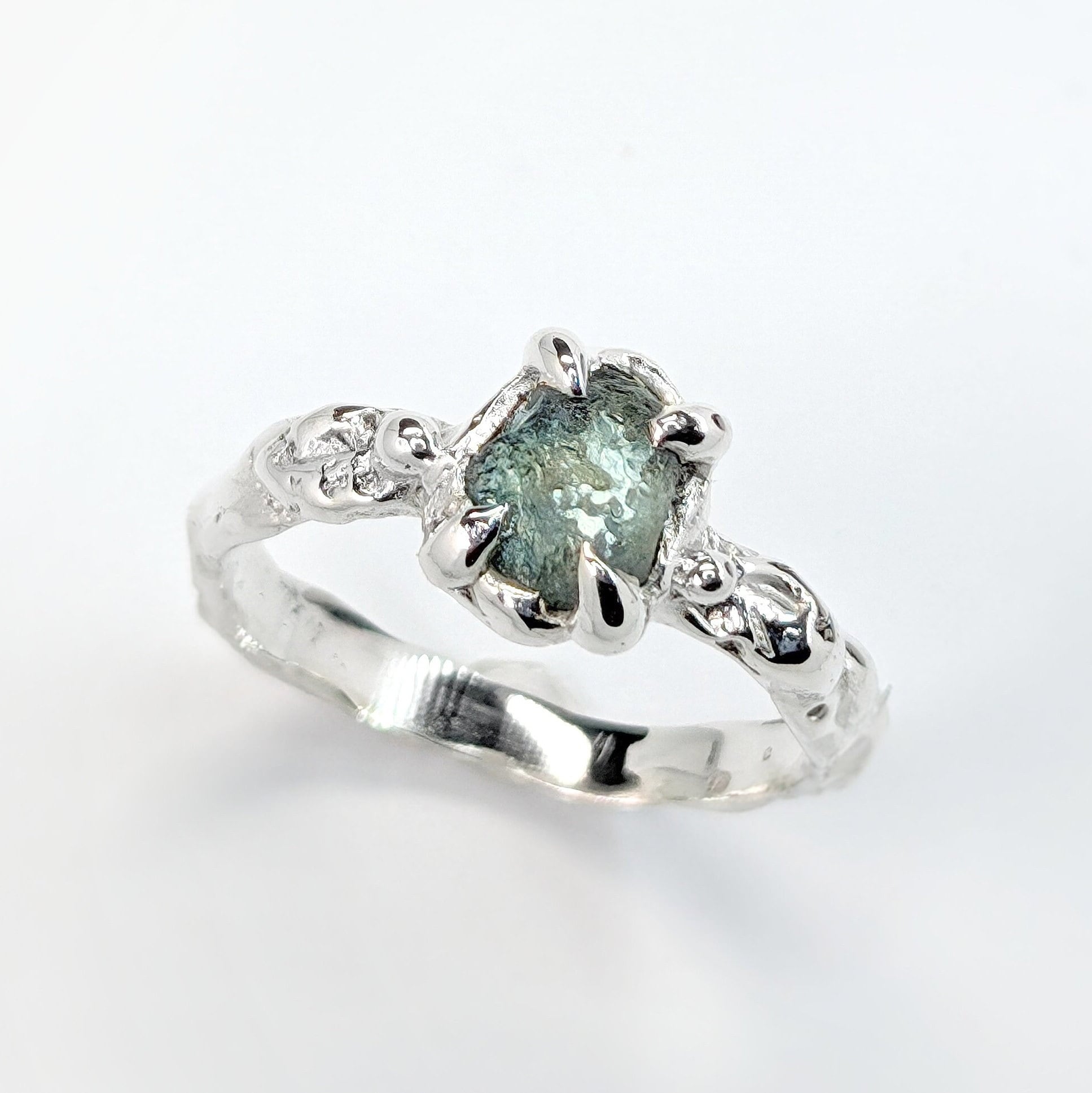 Raw Montana Sapphire ring in sterling silver with an organic molten band, perfect for unique engagement or September birthstone.