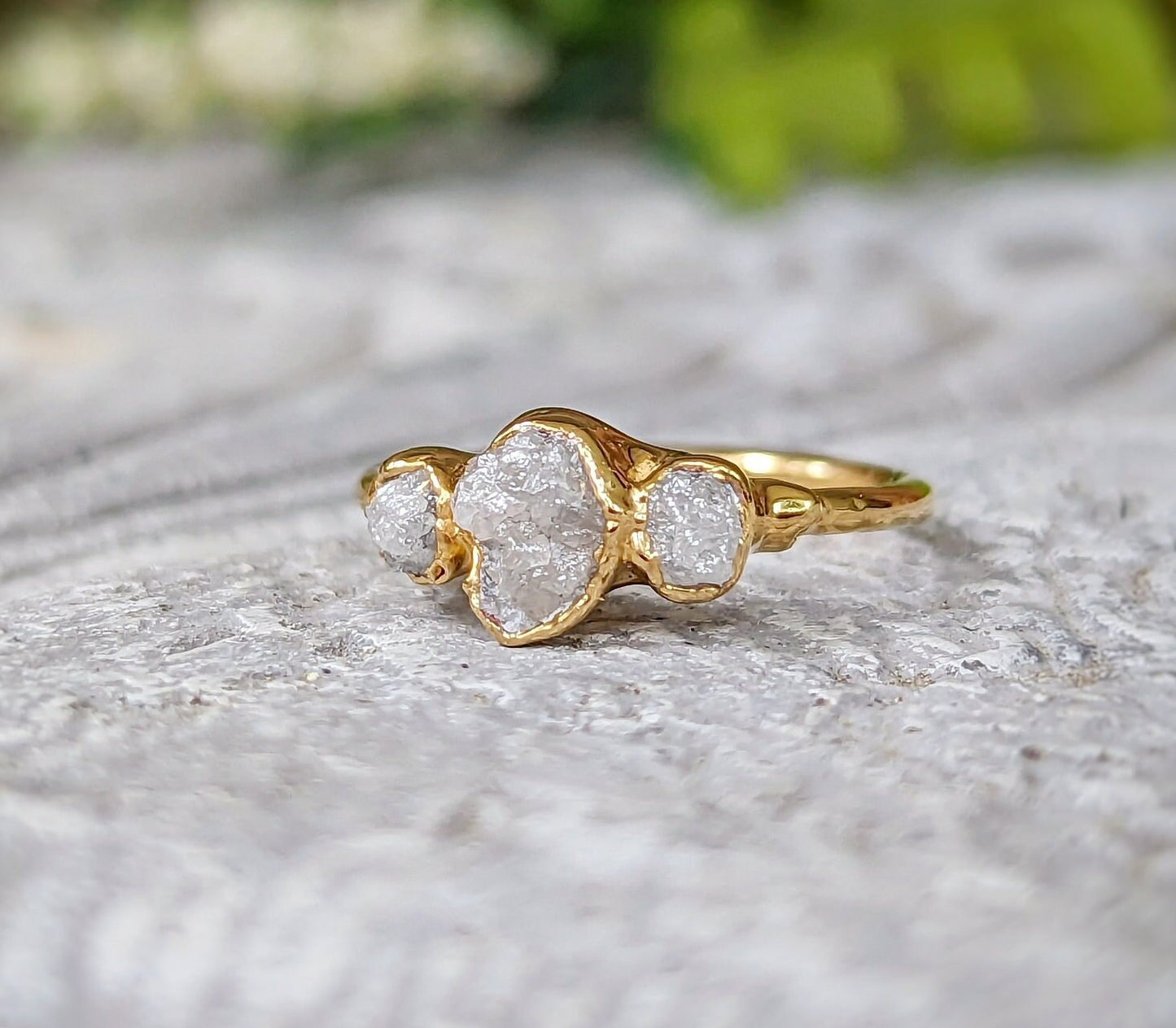 Raw multi diamond engagement ring with uncut diamonds on a handcrafted solid gold band.
