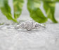 Raw multi diamond engagement ring featuring a large uncut diamond and smaller rough diamonds on a solid gold band.