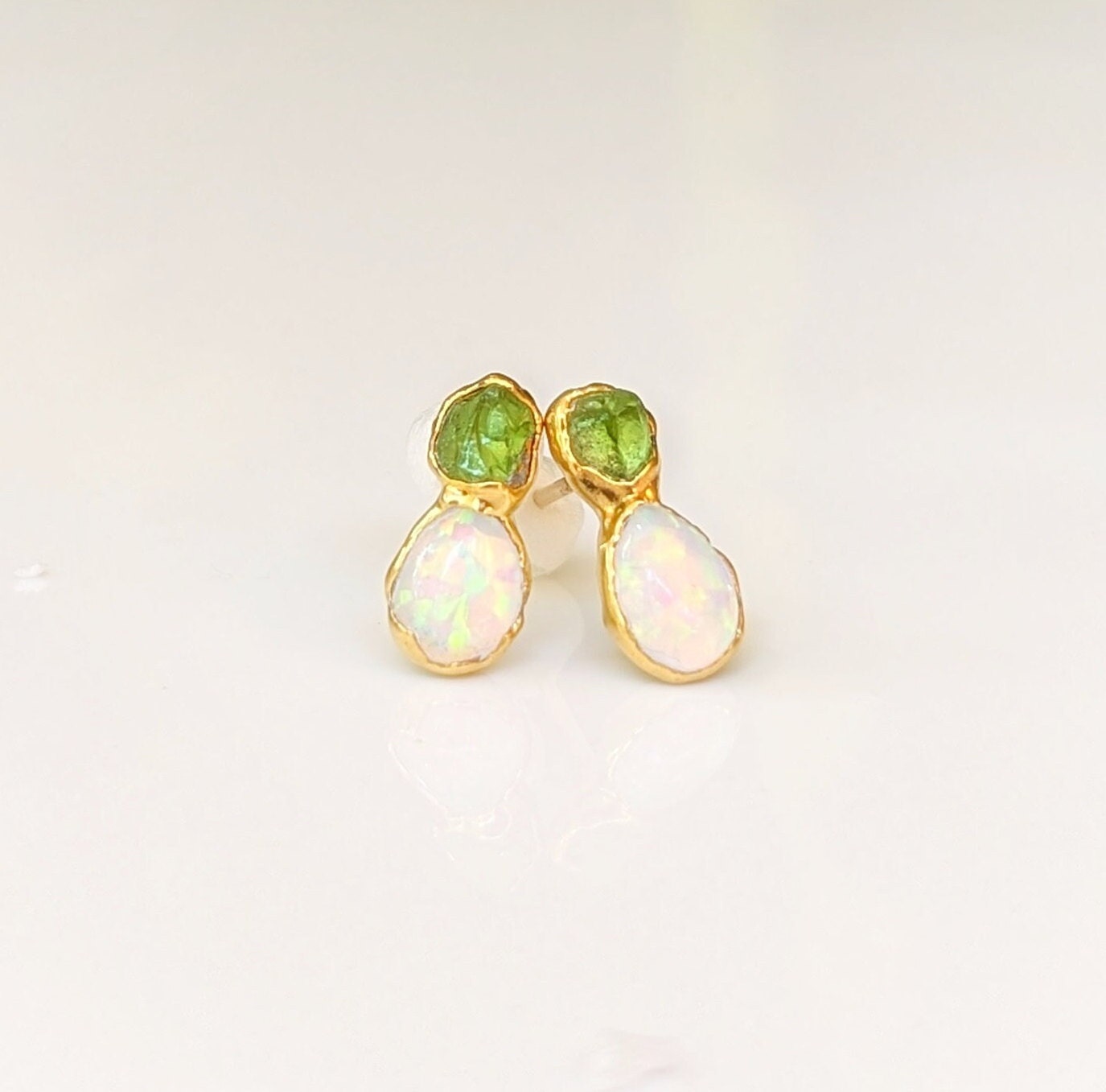 Dainty raw Peridot and Opal stud earrings with gold settings, perfect for bridal or everyday wear.