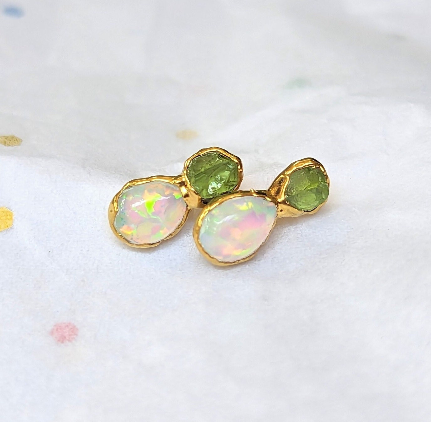 Handcrafted raw Peridot and Opal stud earrings, featuring a rustic yet elegant design, perfect for any occasion.